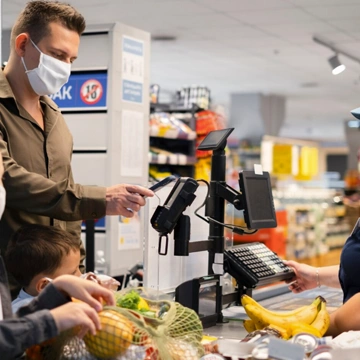 Team defining project requirements around a laptop